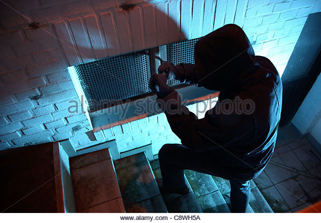 burglar-in-a-private-house-basement-nighttime-burglary-breaking-into-c8wh5a
